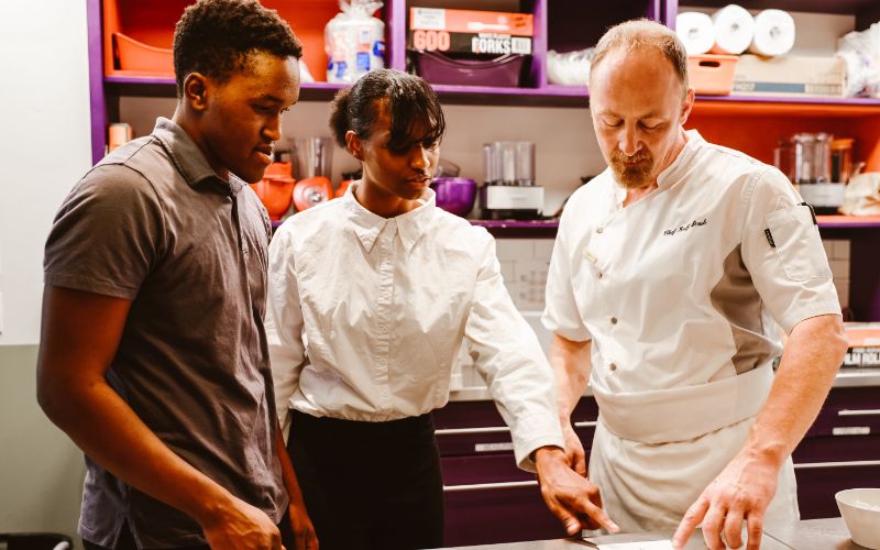 cooks looking at a reciept