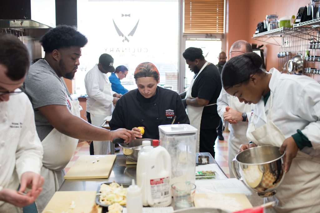Culinary students during the team cook in the training program